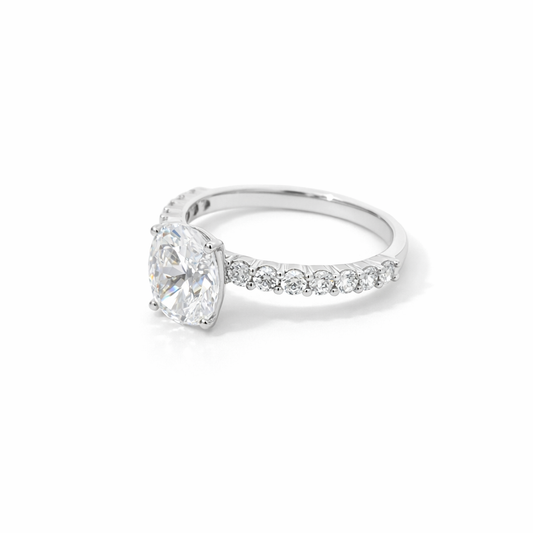 1 ct oval moissanite ring with pavé band, angled view