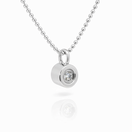 Bezel-set lab-grown diamond pendant, angled view
