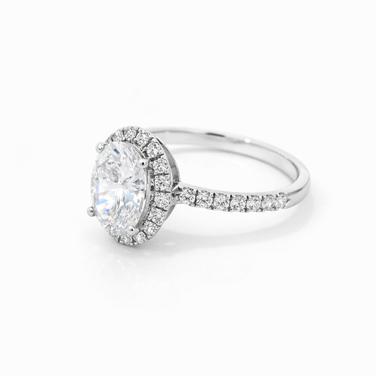 1 ct oval moissanite halo ring with pavé band, angled view